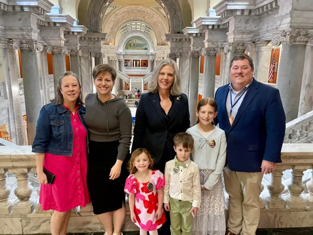 KBC members pose with Senator Shelley Funke Frommeyer after the Senate passed HB90.